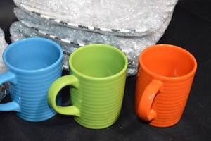lot 19 image: Zebra Print Dinnerware and Colorful Mug Set