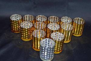 lot 61 image: Set of 12 Gold and Silver Striped & Polka Dot Glass Candle Holders