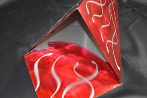 lot 86 image: Handcrafted Red Metal Wall Art Piece with Abstract Design