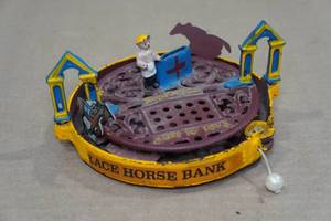 lot 142 image: Cast Iron Horse Race Toy