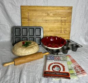 lot 37 image: Baking Bundle - Pans, Pie Keeper, Rolling Pin, Stoneware Pie Pan, Kitchen Towels and Cutting Board