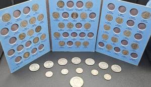 lot 13 image: Jefferson Nickel Collection Book(not complete) plus 6 Kennedy Clad Half Dollars, 1 Bicentennial Einsenhower Clad Dollar and 5 misc nickels