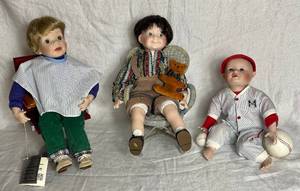 lot 95 image: Danbury Mint Nicholas First Haircut Porcelain Doll, Aston-Drake Porcelain Baseball Player Michael and Heritage Mint Jeffrey  Porcelain Doll