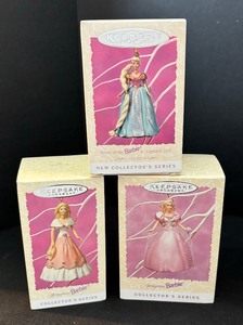 Eight Hallmark Keepsake Ornaments including Hallmark Keepsake Ornament Rapunzel Barbie and More