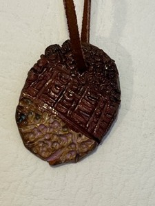 lot 52 image: Vintage Terrecotta Artisan Made Leather Strung Necklace Signed on Back