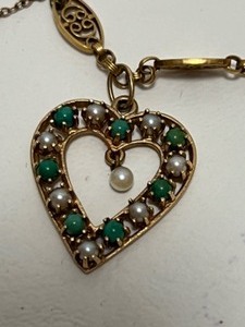 lot 11 image: 14Kt Gold & Gems CHARM BRACELET Including Diamonds, Emeralds Pearls & Rubies 33.9 grams