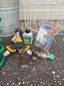 lot 299 image: Garden Lot with Hose w Nozzle and Spigots, Vintage Water Timer in Box, Labeling Stakes, Tools, Galvanized Pails and More