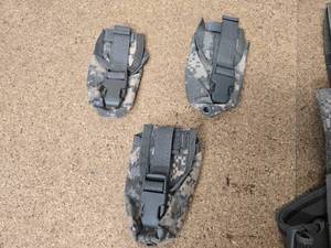 Eagle Industries UH-92F ACU Molle Universal Drop Leg Holster, 3 - Molle II Flash Bang Pouches, and 2 - USGI Individual First Aid Kit Pouches ACU. Everything in excellent condition.