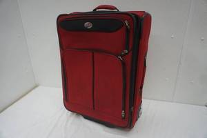 lot 24 image: red American Tourister suitcase