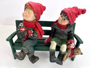 lot 174 image: Norwegian Candy Design Boy And Girl On Park Bench Figurines