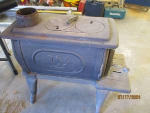 lot 13 image: Logwood USSC wood stove...