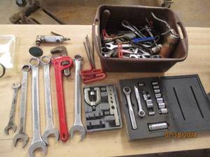 lot 33 image: Tote filled with wrenches, air tool...