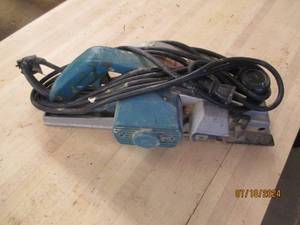 lot 57 image: Makita power planer...