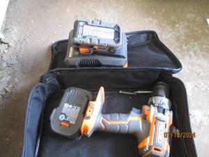 lot 97 image: Ridgid cordless drill in a case...