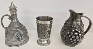 lot 127 image: 2 Vintage Engraved Pewter Pitchers & 1 Wine Goblet