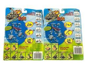 lot 82 image: Vintage 1999 Jakks Pacific Road Champs BXS Die Cast Bike Toy - Sealed with package wear