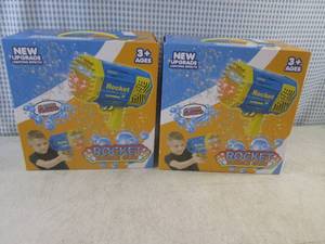lot 79 image: (F-0) 2 Rocket Bubble Guns - USB Rechargeable with Lighting Effects - Both Purple