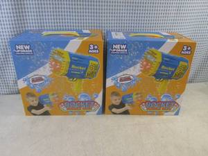 lot 136 image: (F-0) 2 Rocket Bubble Guns - USB Rechargeable with Lighting Effects - Both Purple