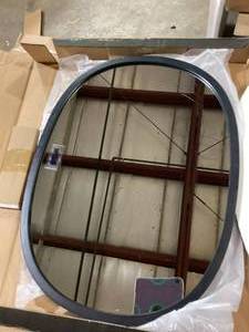lot 23 image: Umbra Hub 24 in. H x 18 in. W Modern Oval Framed Black Mirror    Customer Returns See Pictures