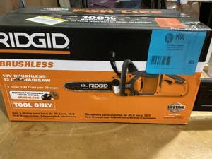 lot 60 image: RIDGID 18V Brushless 12 in. Electric Battery Chainsaw (Tool Only) Customer Returns See Pictures