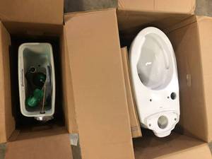 lot 14 image: TOTO Drake 12 in. Rough In Two-Piece 1.6 GPF Single Flush Elongated Toilet in Cotton White, SoftClose Seat Included   Customer Returns See Pictures