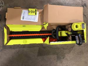 lot 23 image: RYOBI ONE 18V 22 in. Lithium-Ion Cordless Hedge Trimmer with 2.0 Ah Battery and Charger    Customer Returns See Pictures