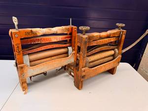 Pair of Antique Anchor brand clothing wringers