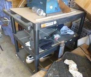 lot 72 image: Luxor Black plastic cart on wheels 35x24x33 tall