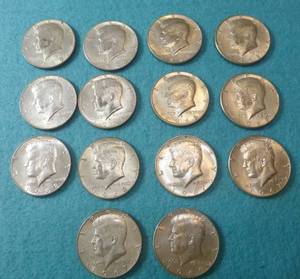 lot 85 image: 14 Kennedy Half Dollars 1966 - 1969