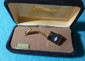 lot 93 image: Signature diamond tie tack