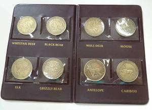 lot 108 image: 120 coin folders to collect and store the different medallions in