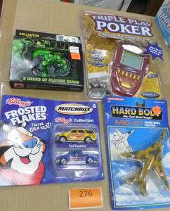 lot 276 image: New toys - Cards, electronic poker game, matchbox cars and airplane
