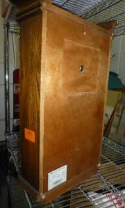 lot 34 image: Howard Miller Wind up Oak Wall  Shelf Clock with Oak Yorkshire Finish $1200 retail