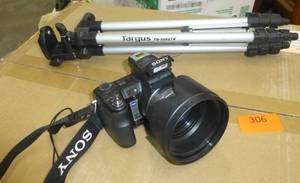 lot 306 image: Sony camera and tripod no battery or charger