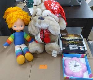lot 316 image: 2 plush, a clock and a Deal or No Deal game