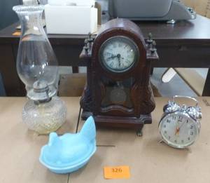 lot 326 image: Vintage oil lamp, battery clock, nesting hen, alarm clock