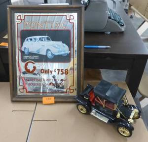 lot 334 image: Pontiac mirror and battery operated car