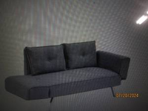 lot 53 image: Serta Molecule Convertible Sofa Bed with Pillows legs need to be nailed back on