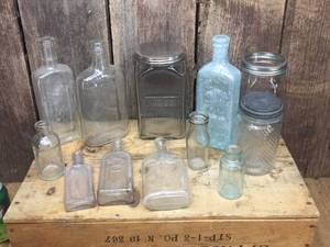 lot 149 image: 12 Vintage Glass BottlesContainers - Embossed