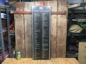 lot 195 image: 101 Greatest Movie Quotes on Board 11 12 x 35 12