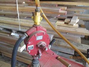 lot 70 image: Gas Caddy with Manual Pump and Wheels - Red