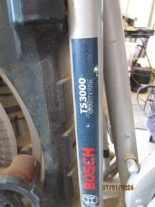 lot 107 image: Bosch TS3000 Gravity-Rise Table Saw Stand