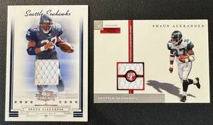 lot 59B image: Shaun Alexander 2 Relic Cards - 2006 Donruss Playoff Threads#84 138200 and 2005 Topps Personal Pieces #PPC-SA 1000 Football Cards