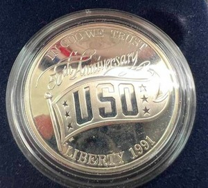 lot 19 image: 1991 USO Proof Silver Dollar