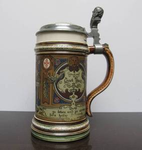 lot 87 image: Original Antique METTLACH German Beer Stein - Man Holding Dumbbell - 12 Liter