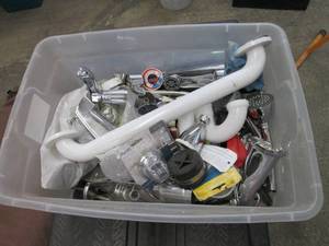 lot 144 image: Tote of miscellaneous plumbing...