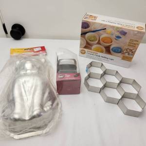 lot 44 image: Vintage Cat Cake Mold Combo, Cake Cutter, Beehive Cake Cutter, and Ceramic Candy Melting Cups