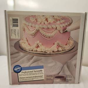 lot 71 image: Brand New in Box Professional Turntable Cake Decorating Tool by Wilton