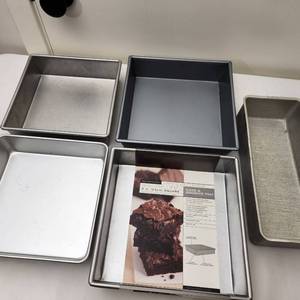 lot 90 image: Four Square New Baking Pans Brownie Pans and One Rectangular Metal Baking Pan