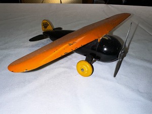 lot 332 image: Vintage Black and Orange Lockheed Metal Plane 8 Long